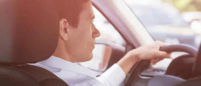 Man behind the wheel of his car